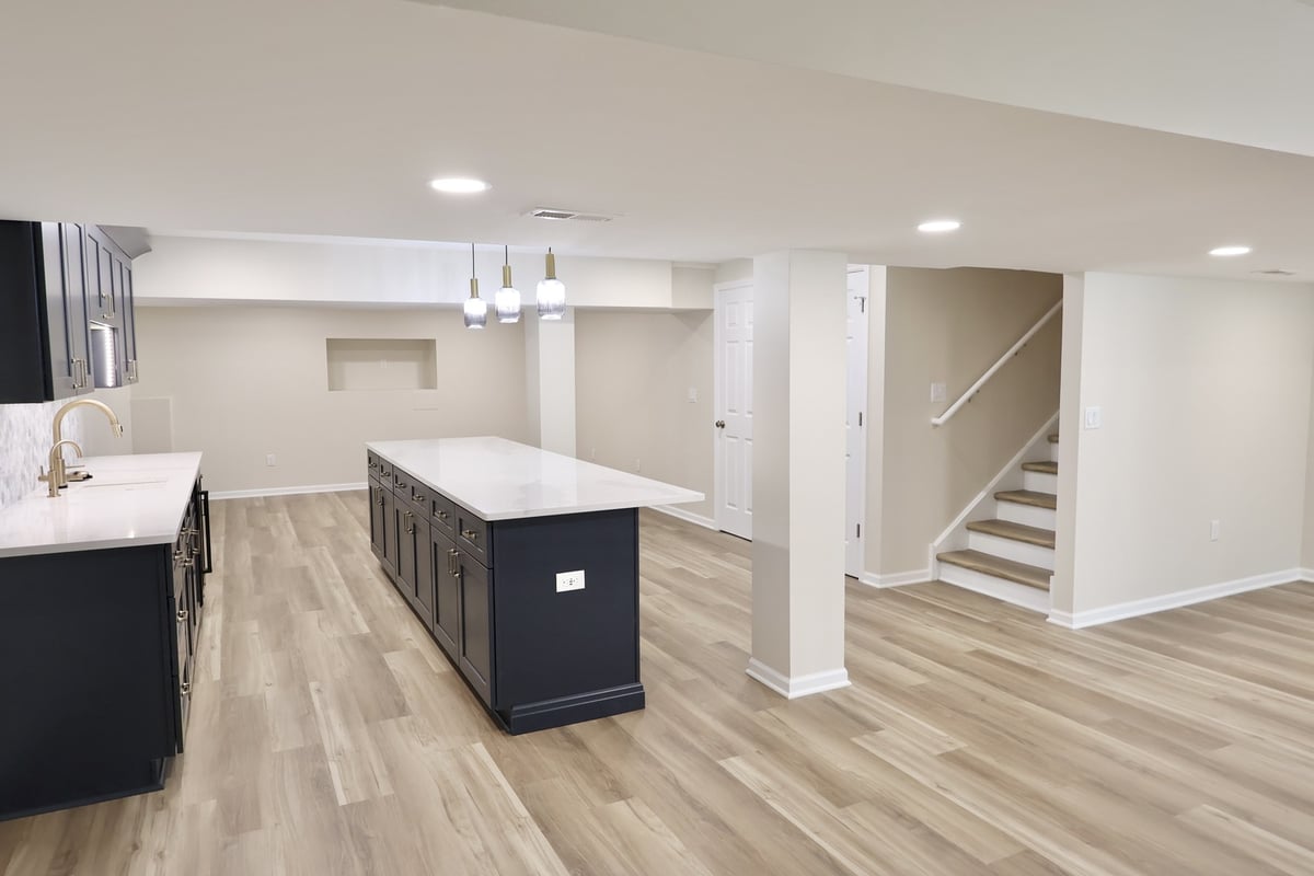 Basement kitchen and stairway layout in Crown Point, IN custom home by Clear Contractors