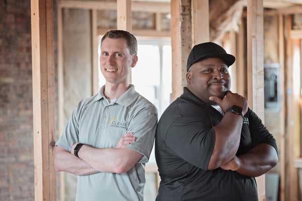 Vince Hausmann and Lorenzo Richard II of Clear Contractors in a professional portrait at a Northwest Indiana construction site