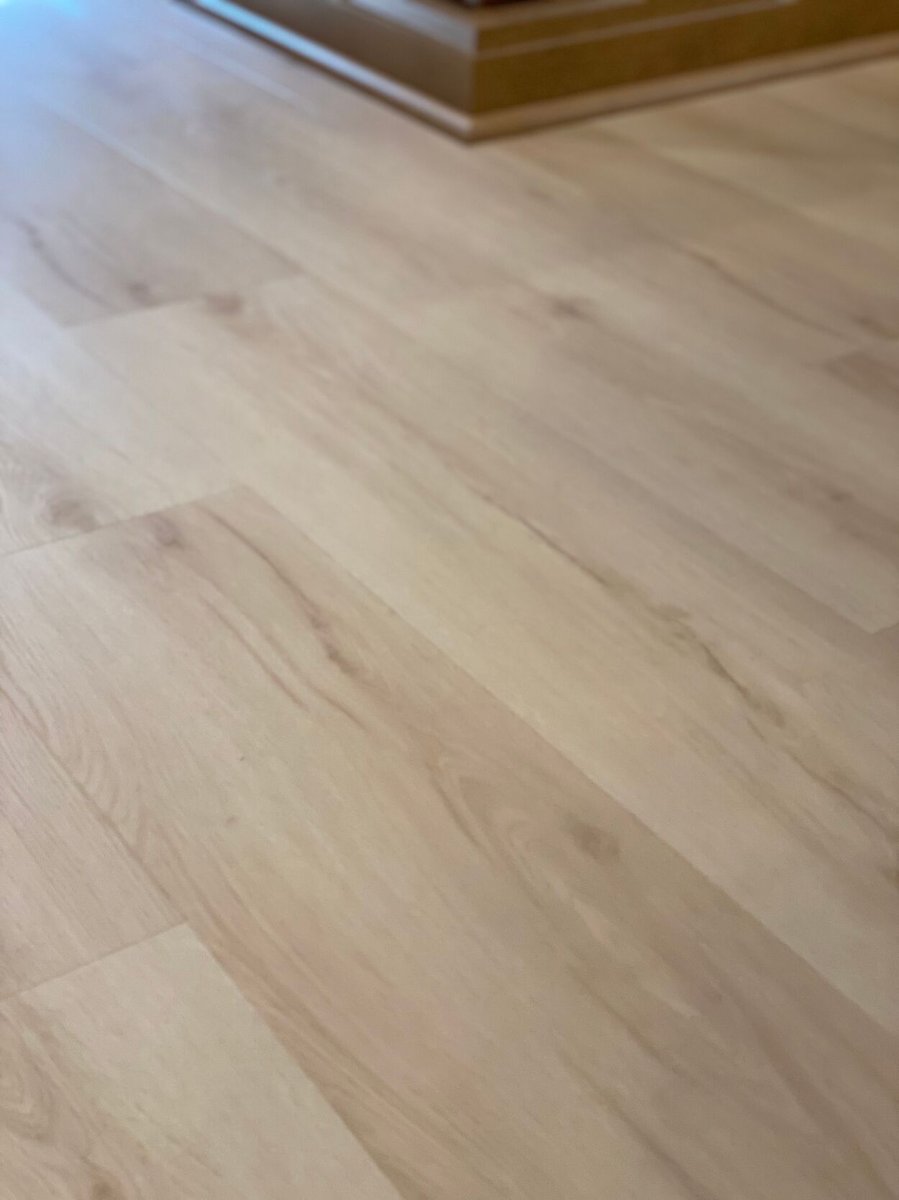 Light-toned hardwood flooring installed during a kitchen remodel in Lynwood by Clear Contractors