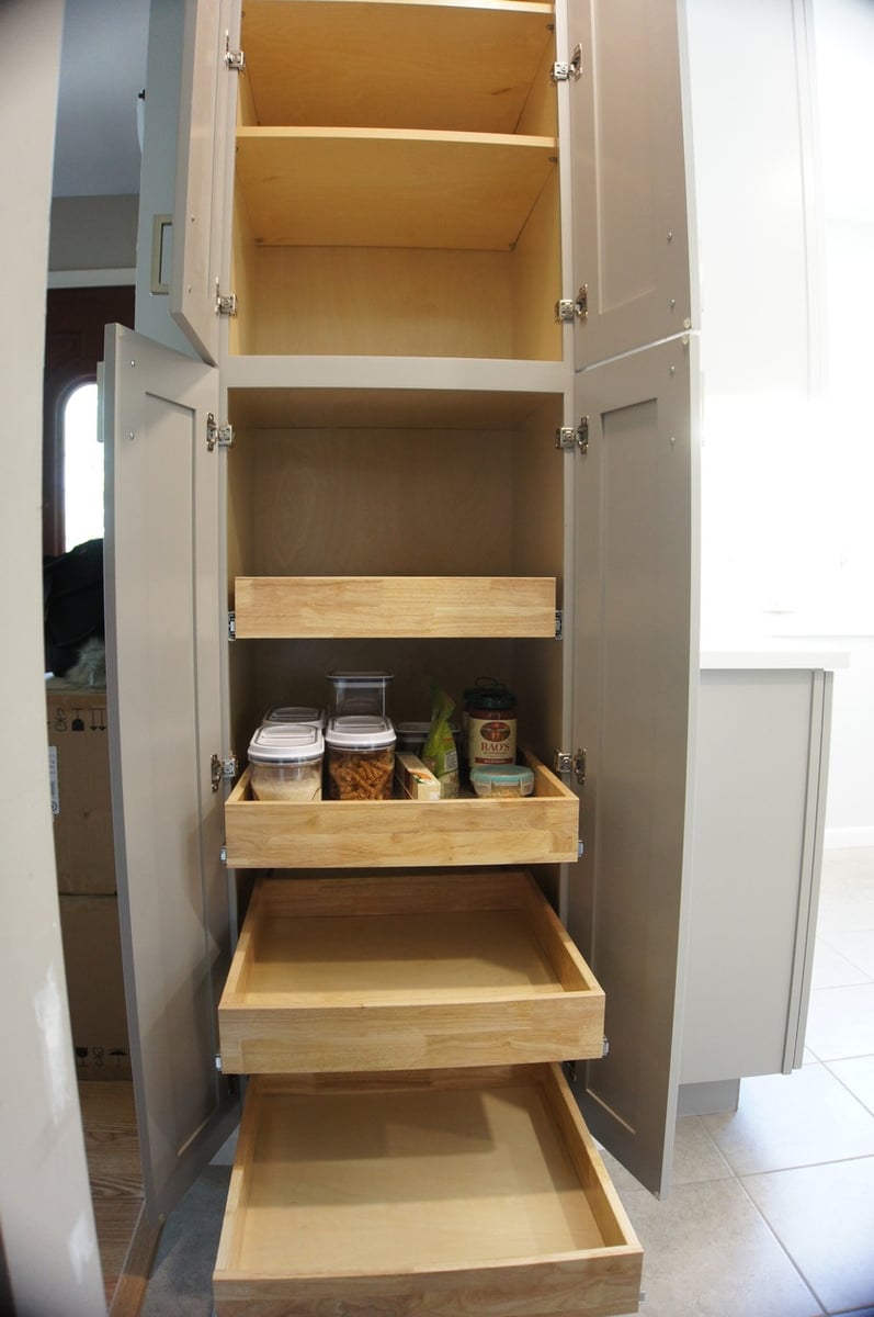Tall pantry cabinet with pull-out shelves and organized storage for Kitchen Remodel in Munster