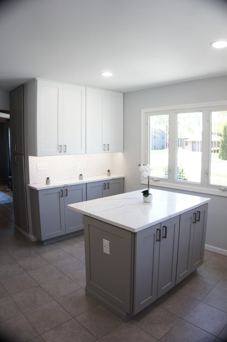 White and gray kitchen with center island and recessed lighting for Kitchen Remodel in Munster