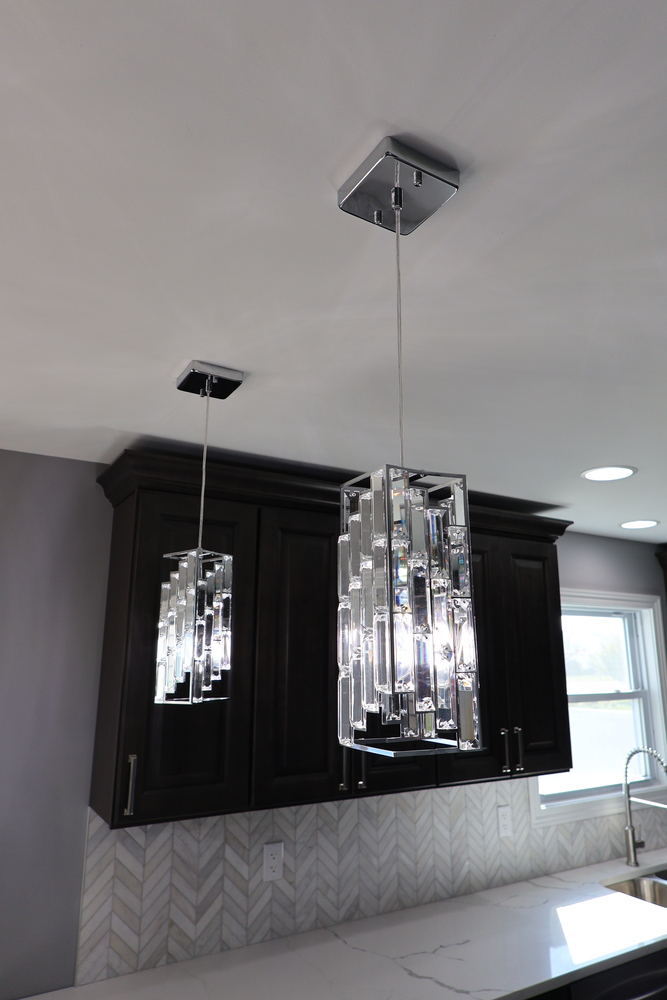 Modern pendant lights with crystal accents in a Schererville kitchen by Clear Contractors.
